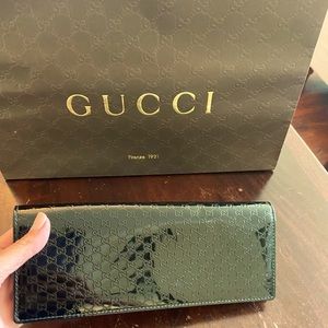 Black Gucci patent clutch. Suede interior, like new!